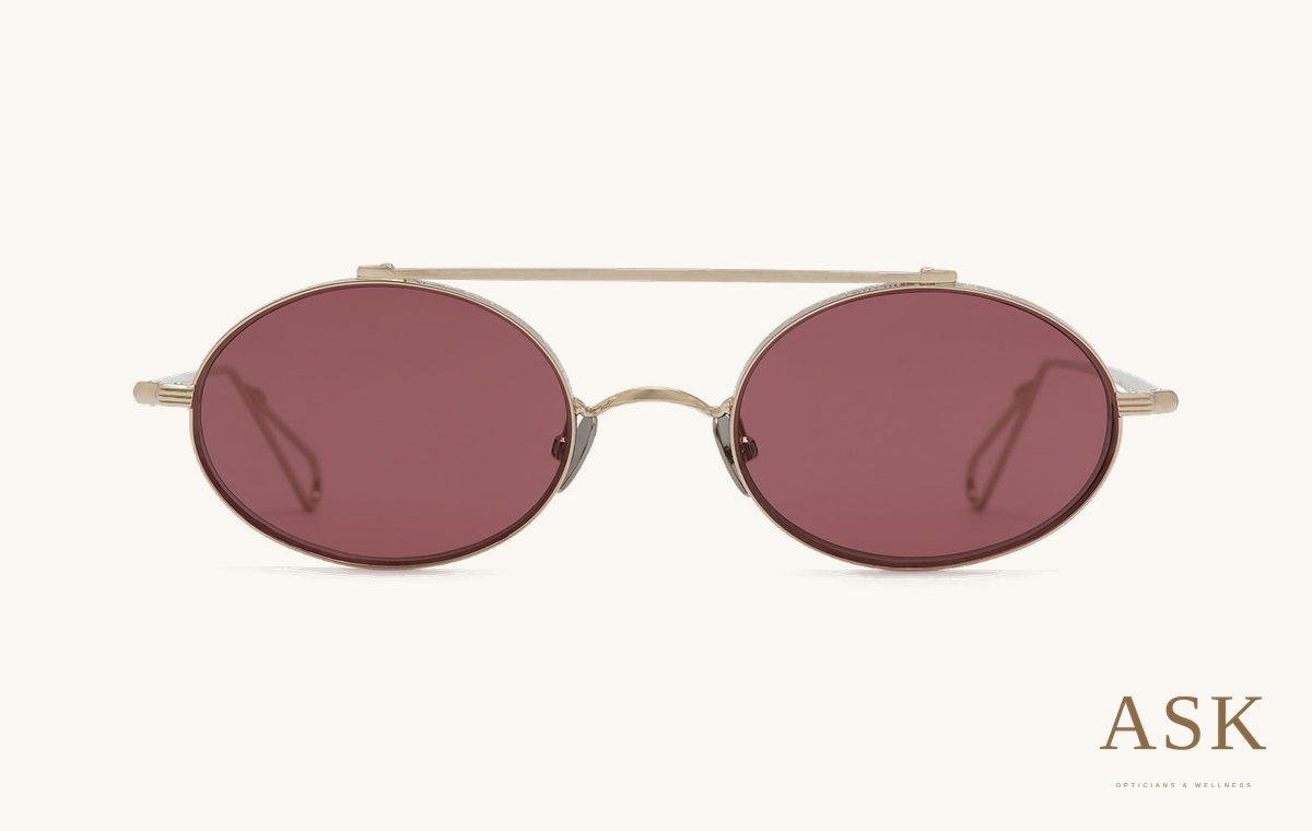 AHLEM Turbigo — Sunglasses, Grey Gold / Plum, front view on ivory with the ASK logo