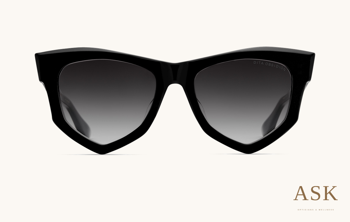 DITA Obsidion, Black Glass / Grey to Clear Gradient, front view on ivory with the ASK logo