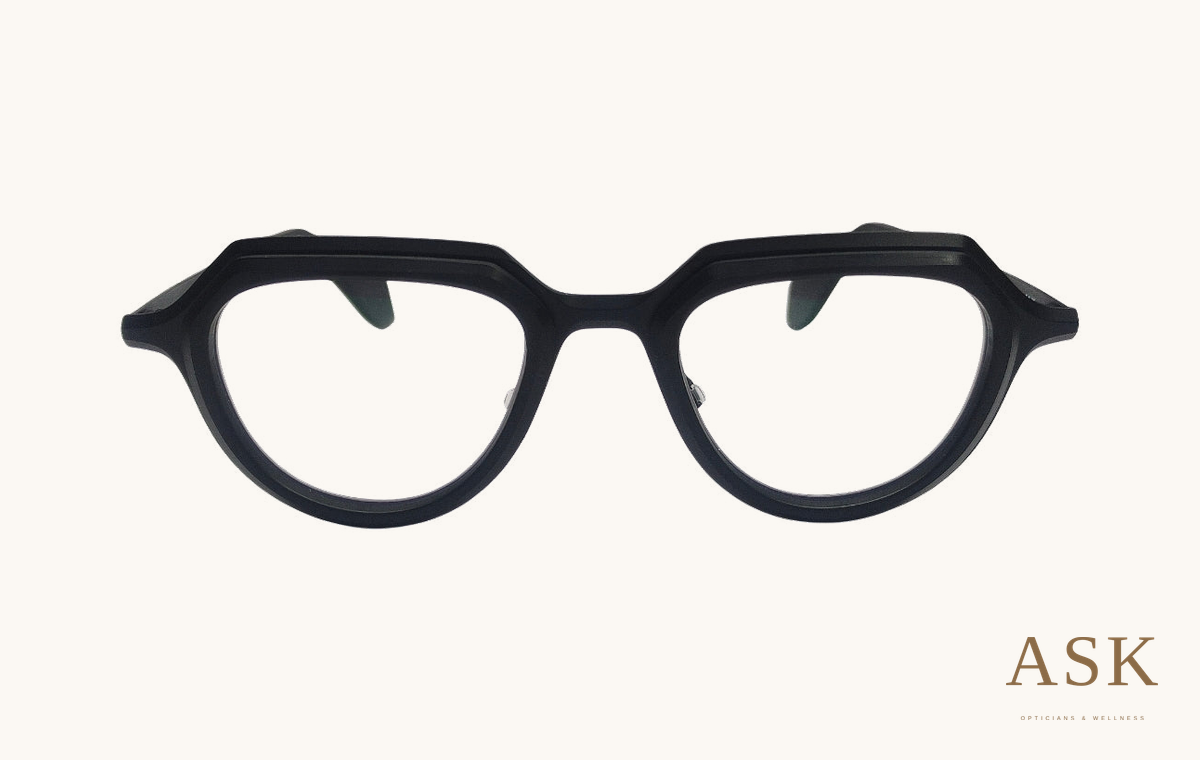 Theo Prong, 001 — Black (47 mm), front view on ivory with the ASK logo