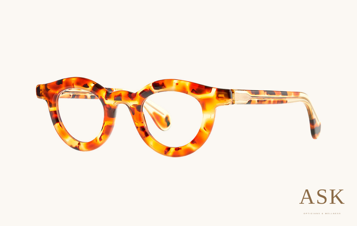 Theo Sassi, Warm brown / caramel tortoise, three-quarter view on ivory with the ASK logo