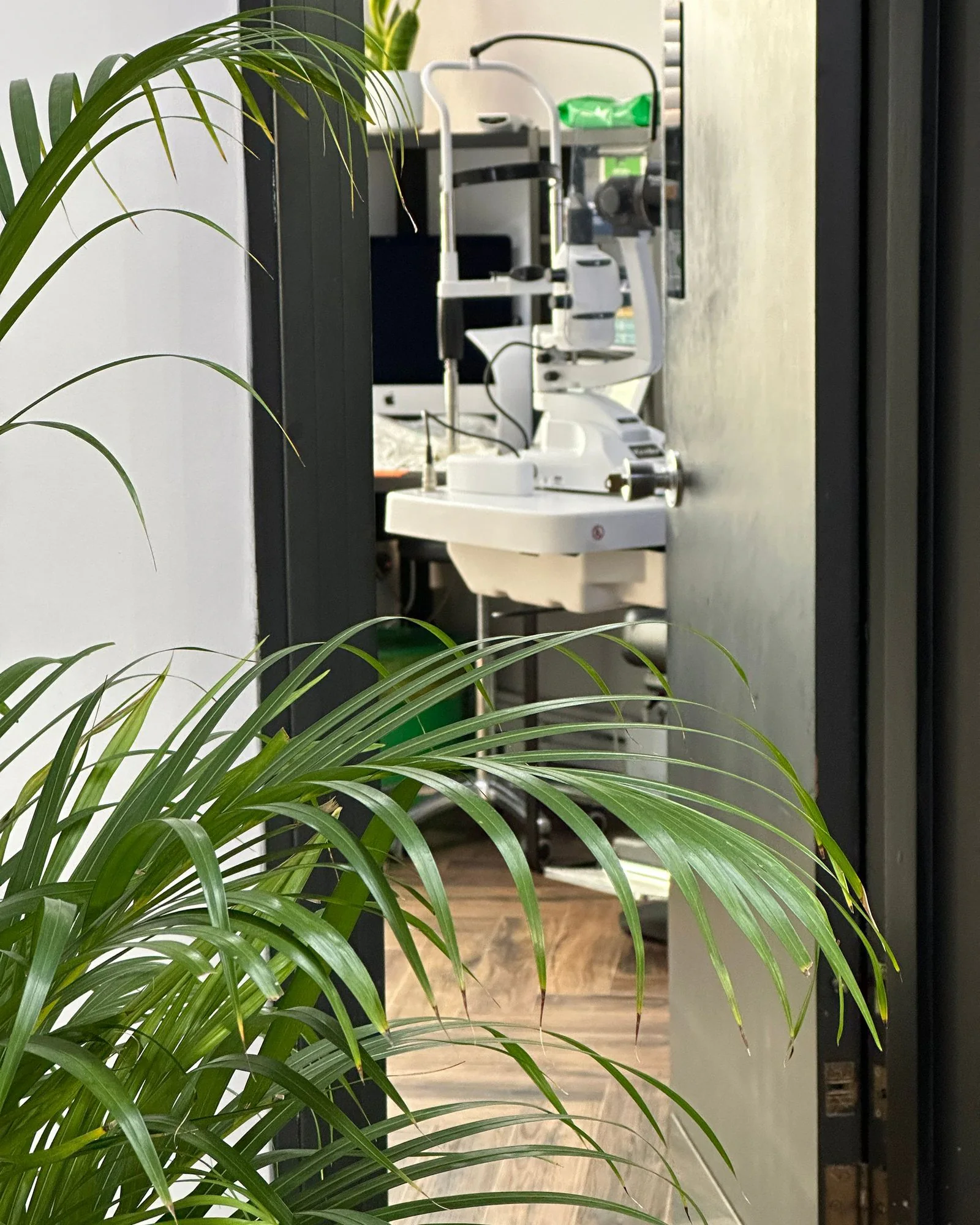 The consulting room at ASK Opticians, seen through the doorway
