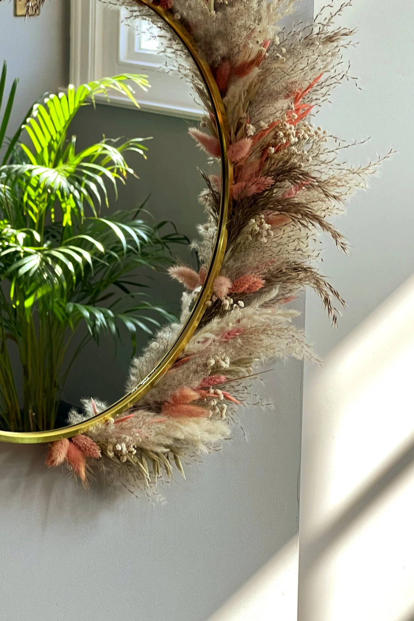 The pampas mirror by the door