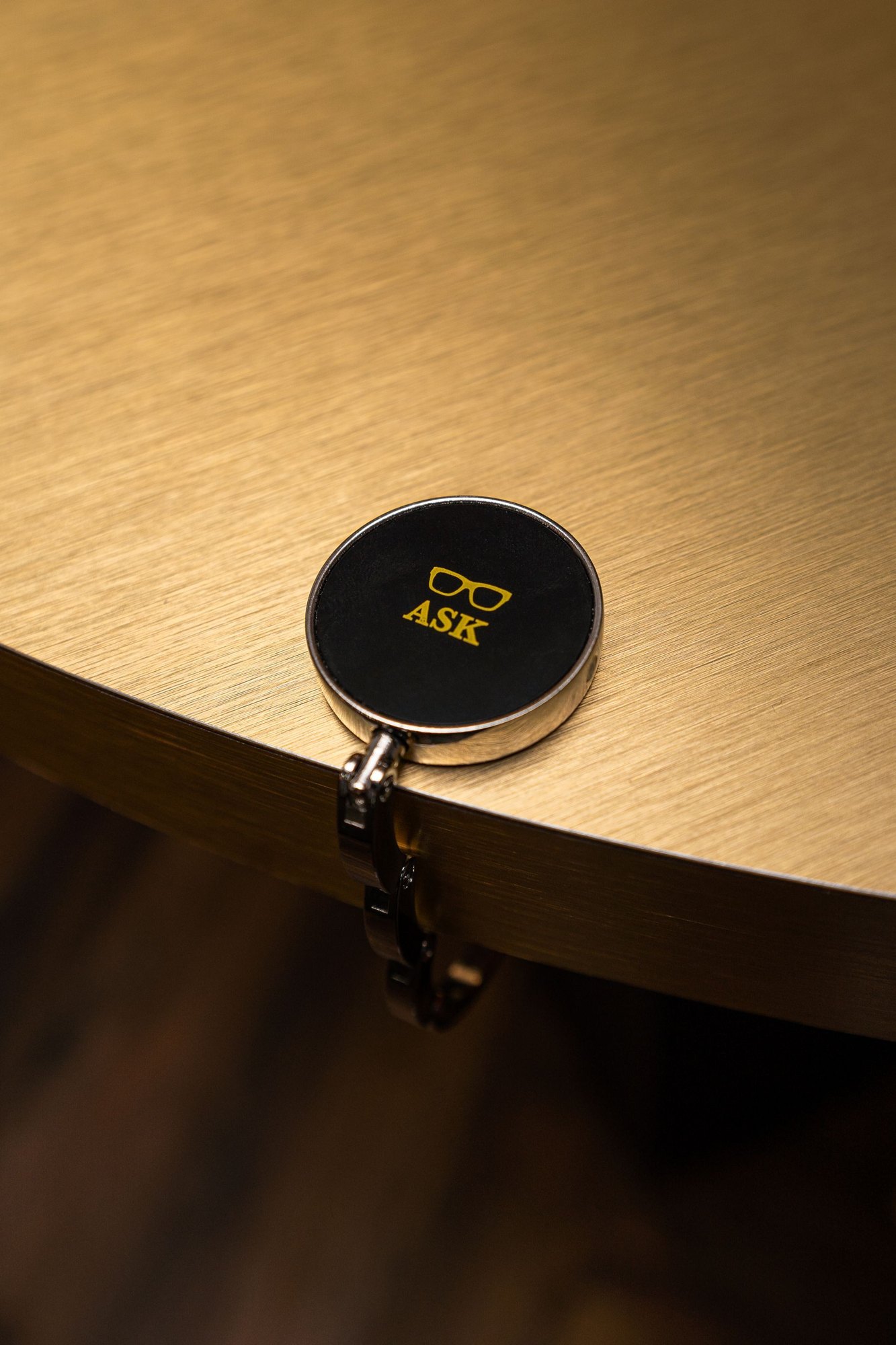The ASK hook on the edge of the bar