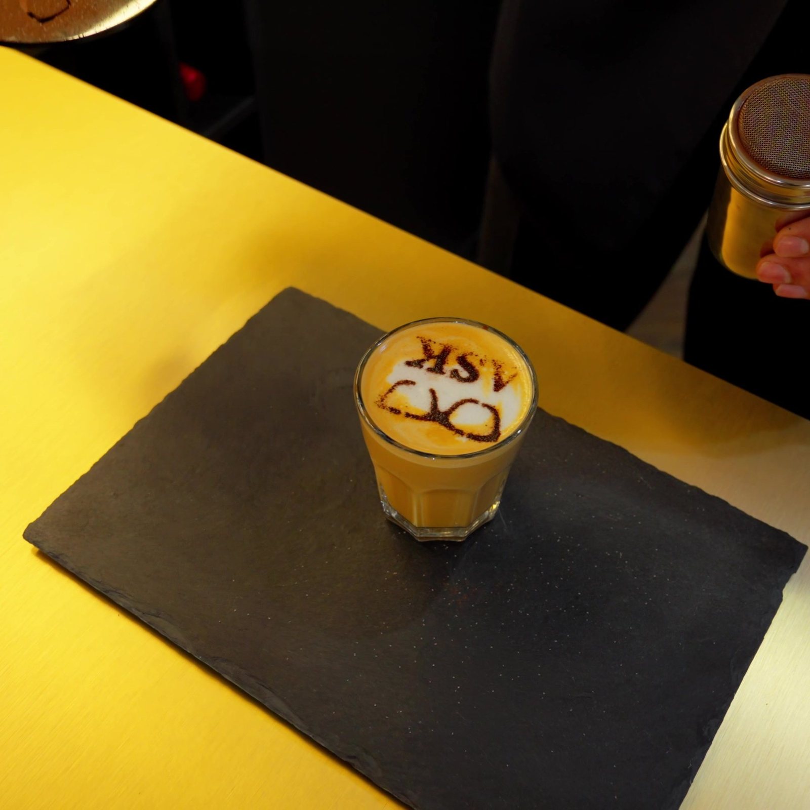 A coffee at the ASK Bar, finished with the ASK logo
