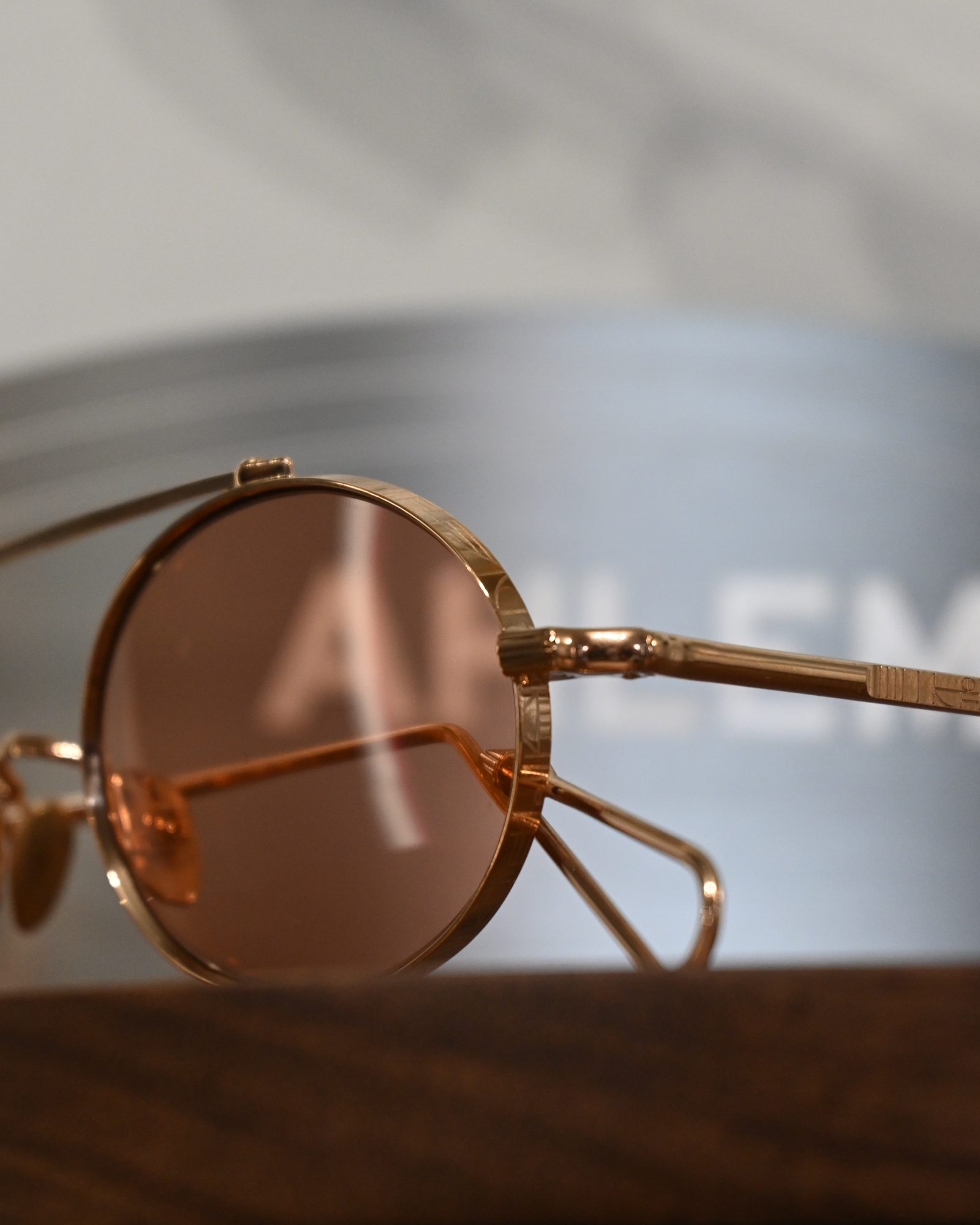 Rose tinted lenses in a gold frame photographed at ASK