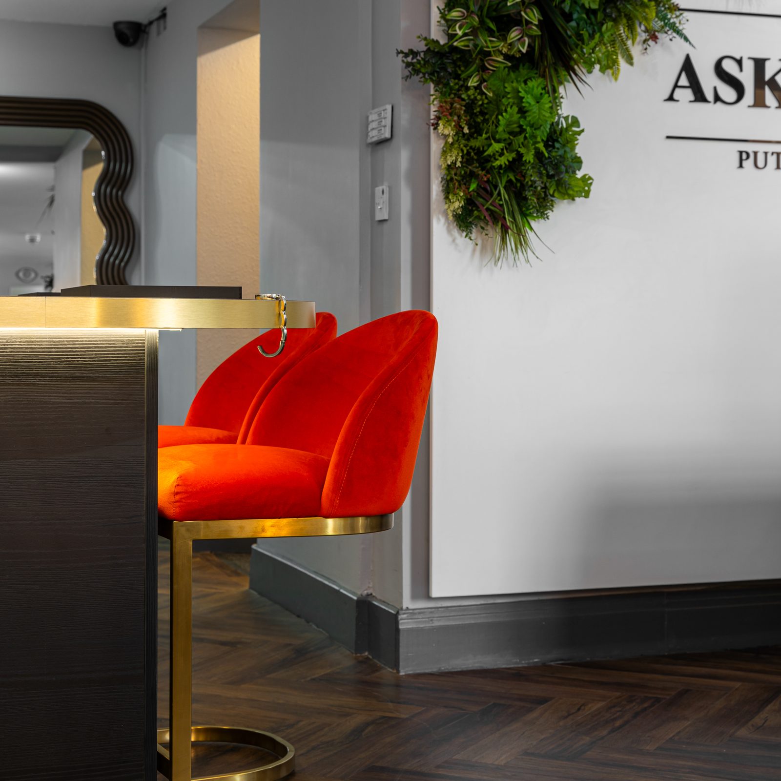 A red velvet stool at the ASK Bar