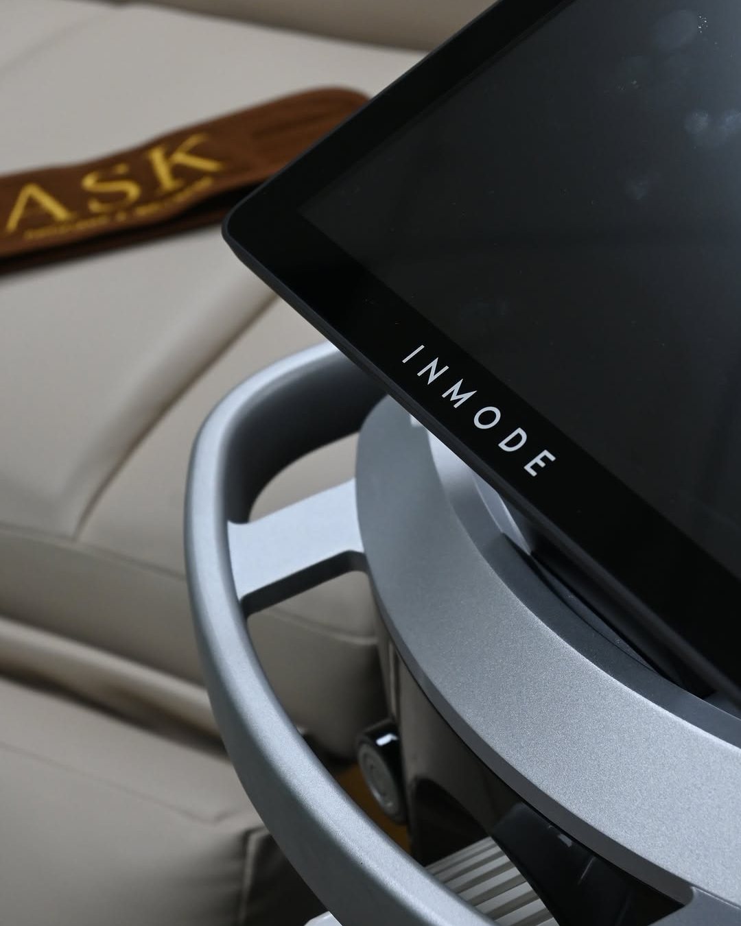 The InMode Envision screen beside the treatment bed