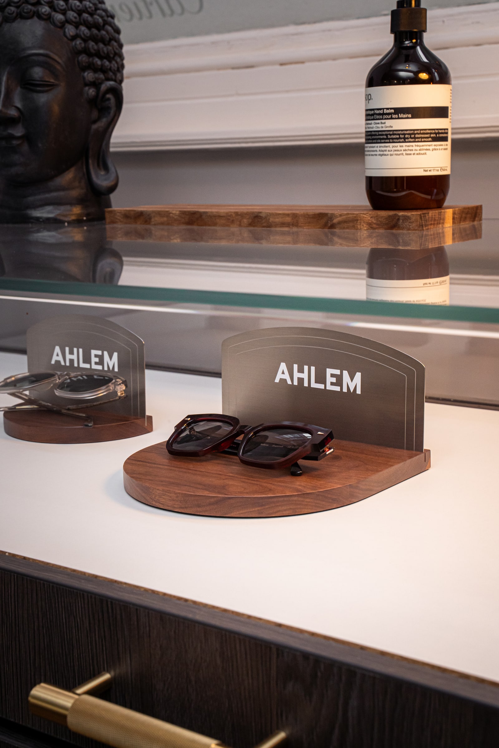 AHLEM eyewear displayed in the glass cabinet at ASK