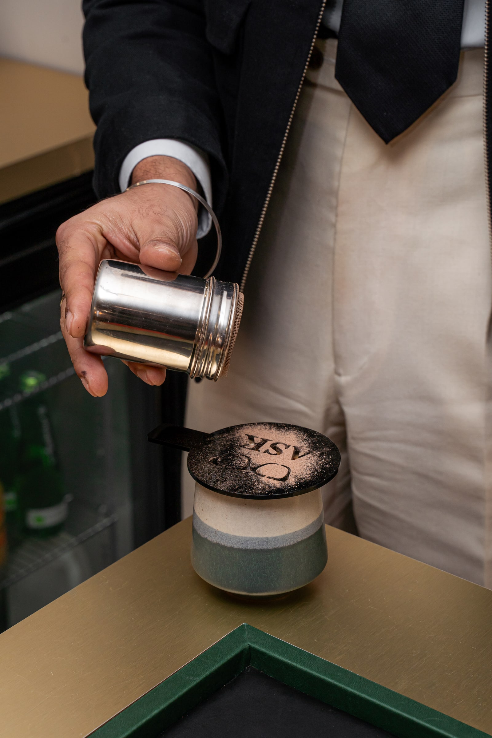 An ASK coffee being finished at the bar