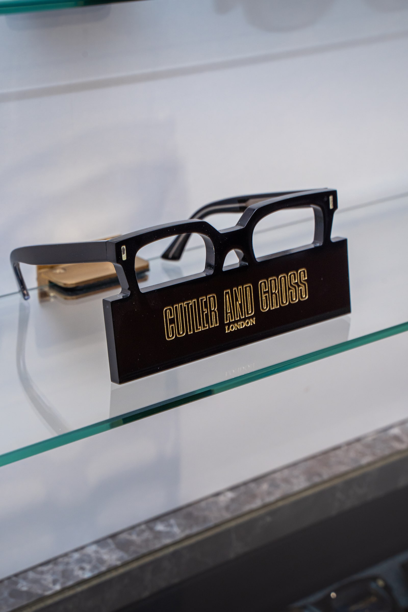 Cutler and Gross frames on the glass shelves at ASK