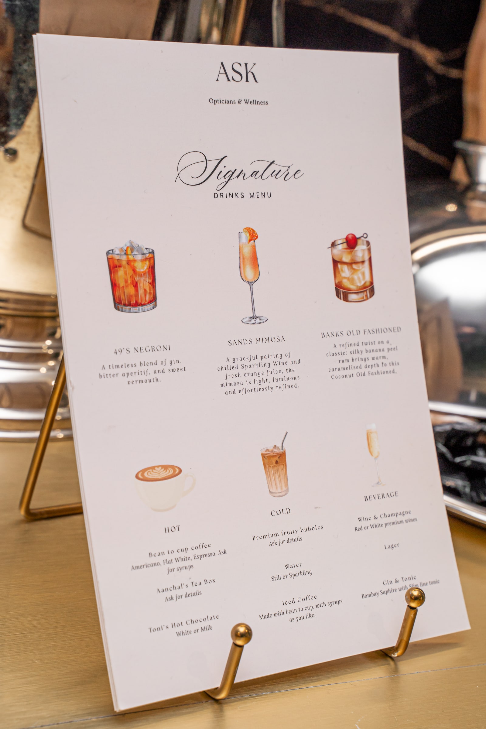The ASK signature drinks menu on the bar