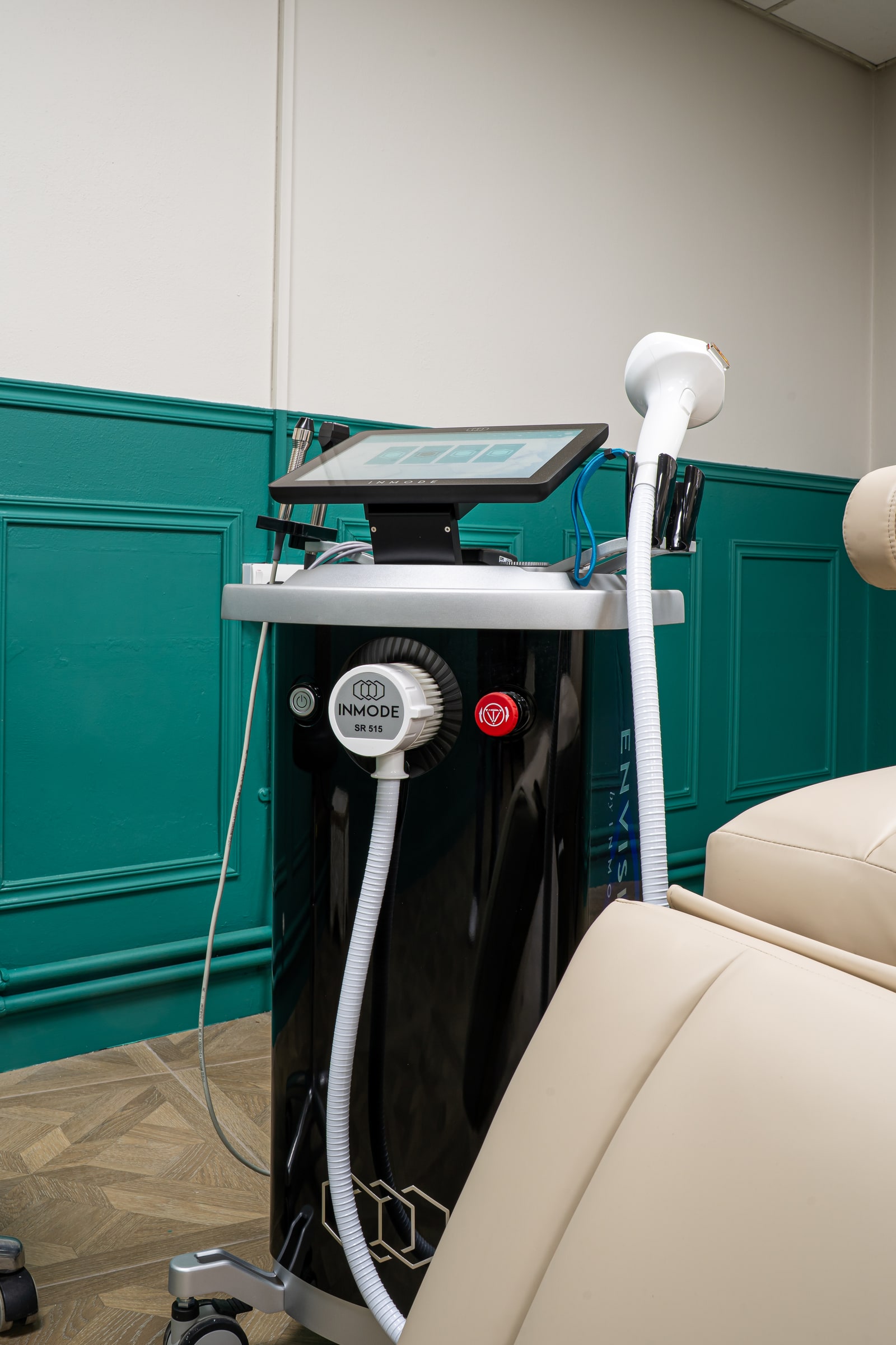 The InMode treatment equipment beside the wellness chair